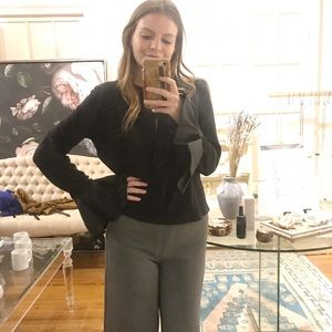 Black long sleeve shirt with flared sleeves